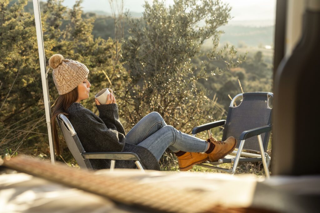 side-view-woman-relaxing-car-while-road-trip